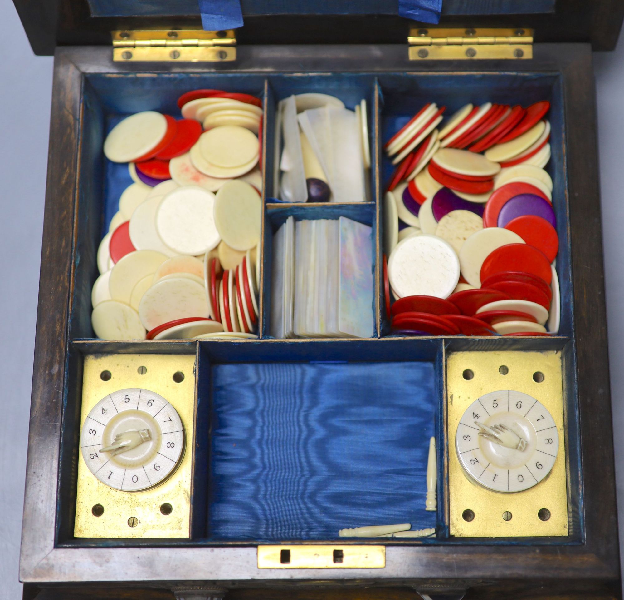 A Victorian coromandel, brass and agate mounted bezique games box, 24.5cm, containing bone and mother of pearl counters, two ivory poin